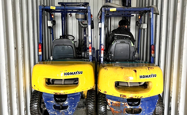 Heavy machinery packed into a container